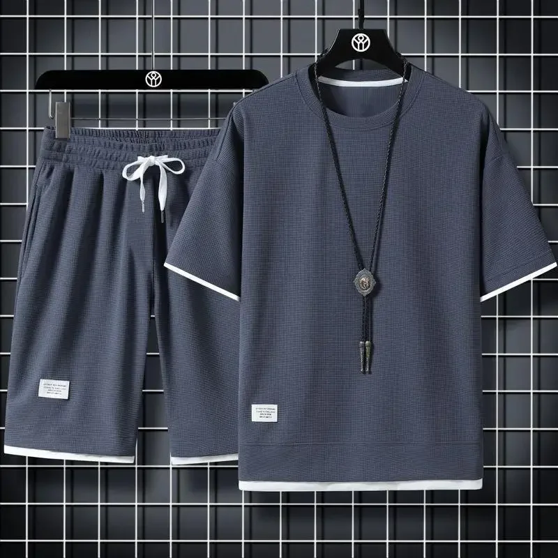 ملابس رياضية صيفية غير رسمية فضفاضة تناسب الرجال البدلة الكورية العصرية قصيرة الأكمام تي شيرت 2 قطعة مجموعة خفيفة الوزن المألوف Streetwea